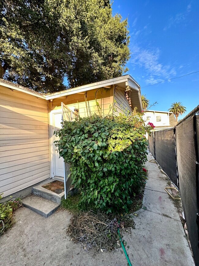 Main entrance is on the side. The fence is temporary during the construction - 189 S Roosevelt Ave