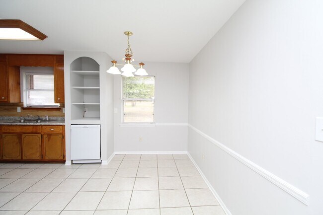 Building Photo - Charming 3-Bedroom Brick Home on Half an A...