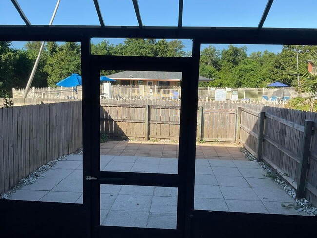 enjoy your screened in porch with our door fan and storage area - 201 Pensacola Beach Rd