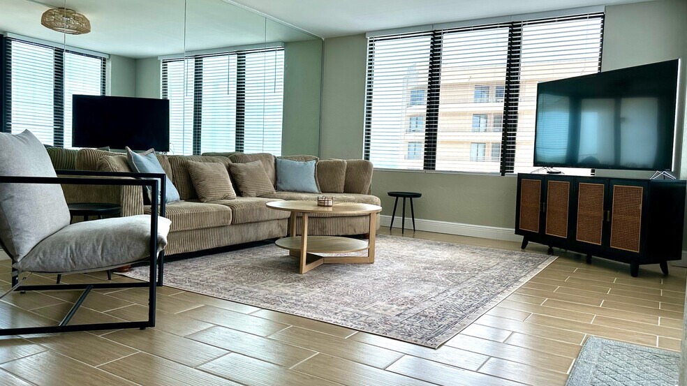 living room with 65 inch tv, cable included - 3043 S Atlantic Ave