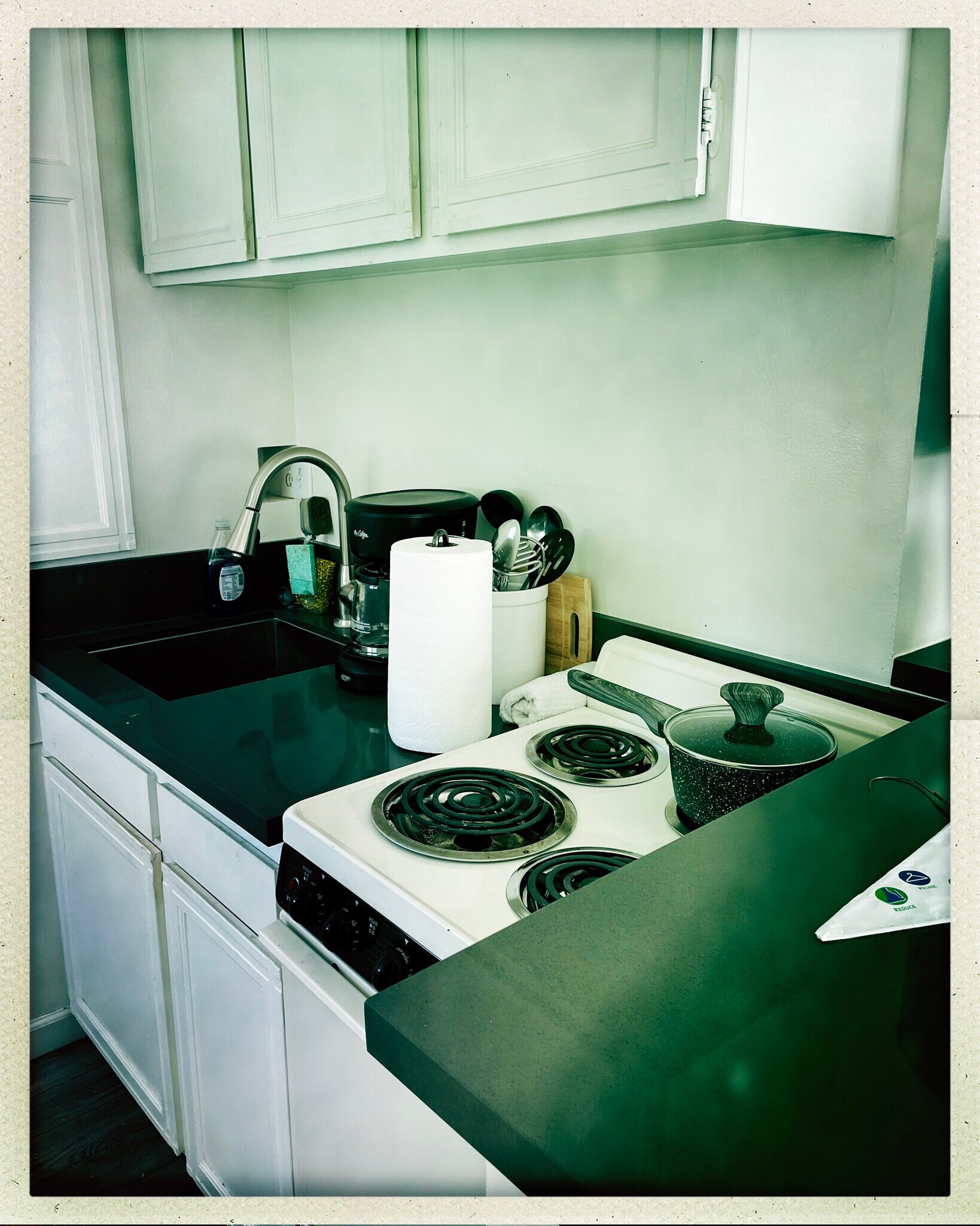 Small kitchenette with 4 burner stove and oven, pots, pans, utensils and coffee maker - 15 Spinnaker St