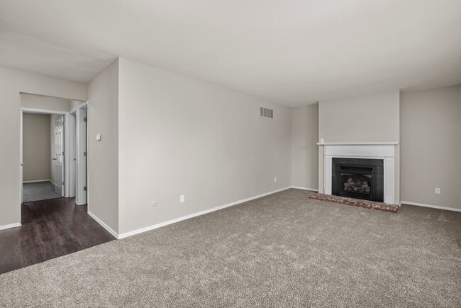 Two Bedroom Garden Remodel with Fireplace | Living & Dining Space - Woods Mill Park Apartments & Townhomes