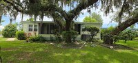 Building Photo - 2 bed 2 baths with carport