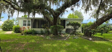 Building Photo - 2 bed 2 baths with carport