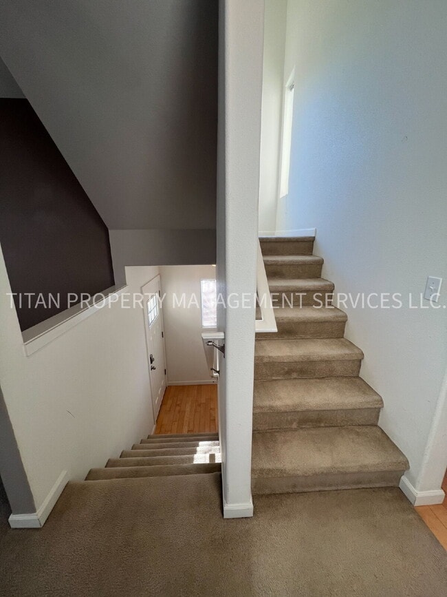 Building Photo - Beautiful Three Story Townhouse with Gas Fireplace, Balcony & 2-Car Garage