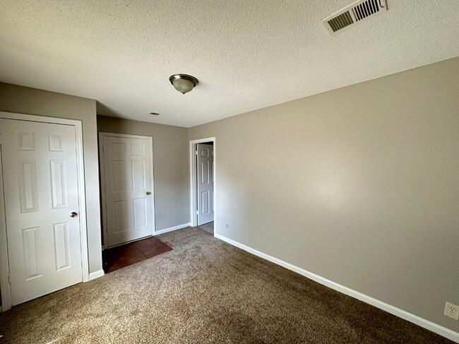 Building Photo - Grand 4BR/2BA Near Southwind | 2,438 Sq Ft, Stone Fireplace, Soaking Tub & 2-Car Garage