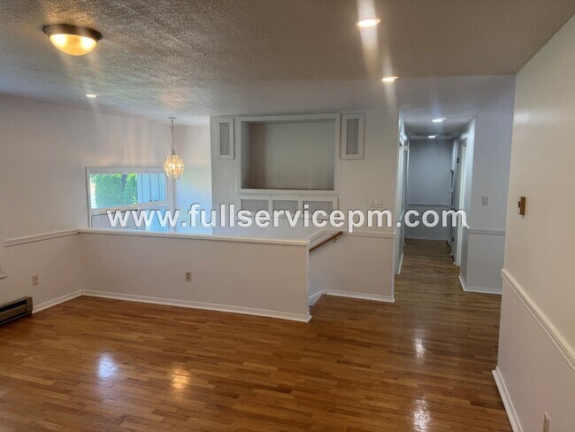 Building Photo - Spacious 4-Bedroom Upper-Level Home with Fireplace, Bonus Room & Large Deck