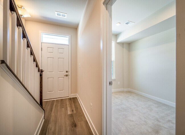 Building Photo - This 3-bedroom, 3-full bathroom townhouse offers a pristine and contemporary living experience.
