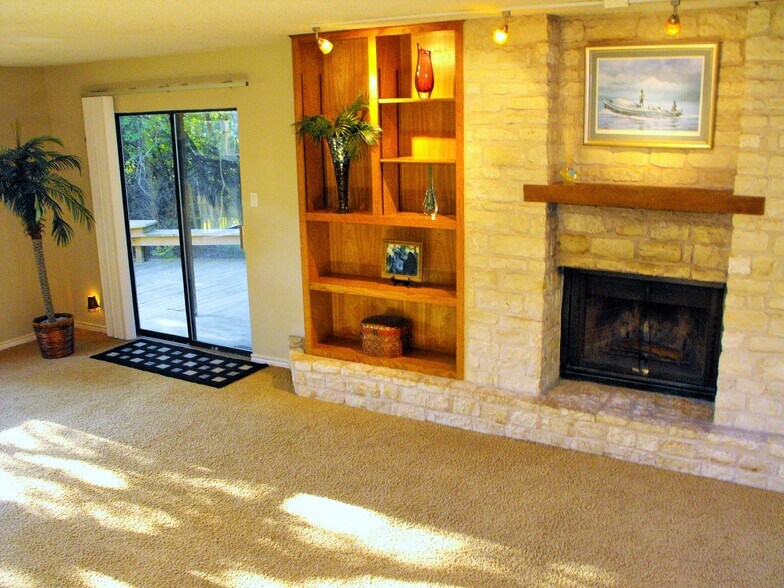 Fireplace wccented by white stone - 9810 Lake Ridge Dr