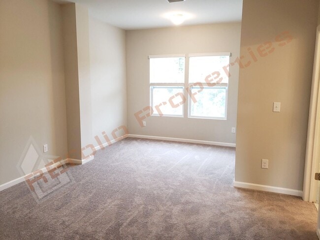 Building Photo - Beautiful Luxury 3 Story 3 Bedroom Townhome with 1st Floor Guest Suite, Attached 2 Car Garage, Co...