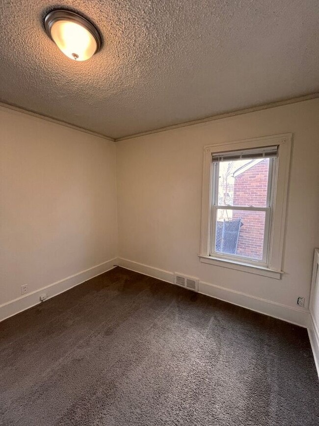 Building Photo - Cozy and Bright 2-Bedroom Duplex with Fire...