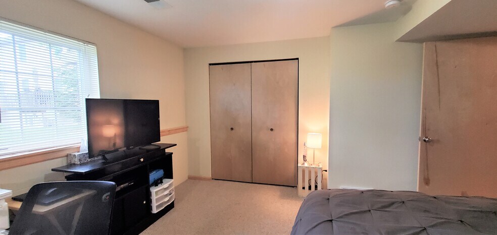 Lower level bedroom. (photo from neighboring unit with the same layout) - 1756 St Joseph St