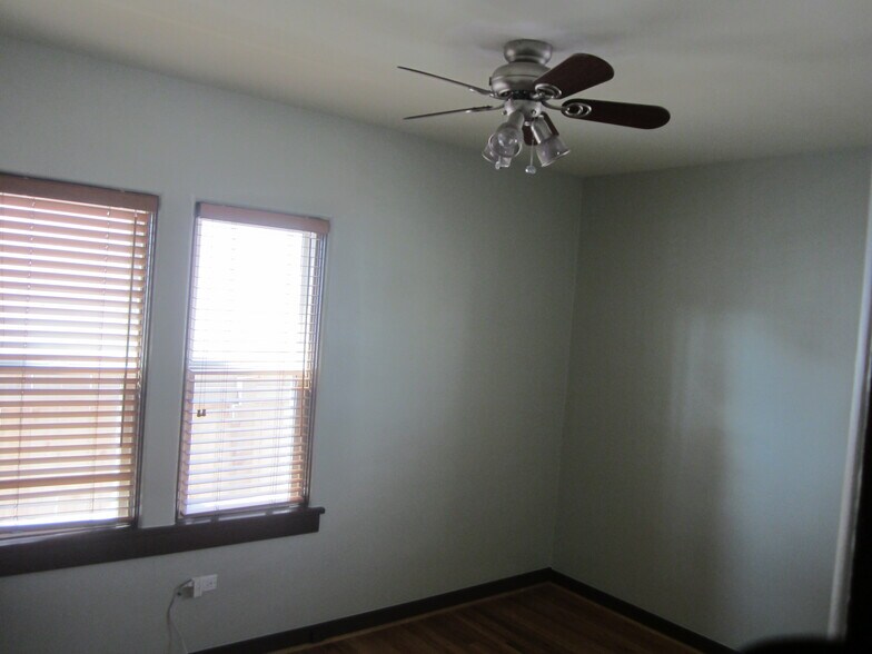 Both bedrooms have two windows and ceiling fans. - 7605 Robinson Way