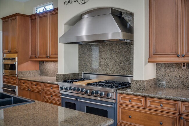 Entertain in this professional chefs kitchen with Sub-Zero and Viking adjacent to the great room. - 2850 Bronzino Ct