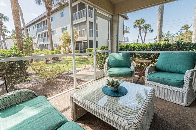 Building Photo - AVAILABLE NOW! Furnished Ground-Floor End Unit | Lake & Pool Views | Minutes to Marco Island & Do...
