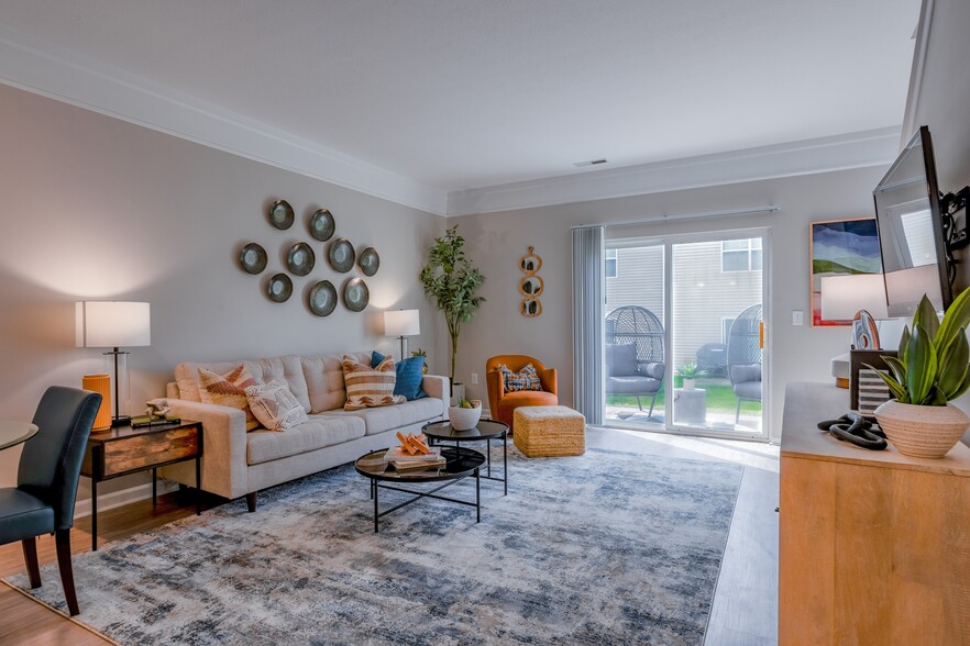 Newly Renovated Living Room with Patio - Hilliard Grand Apartments