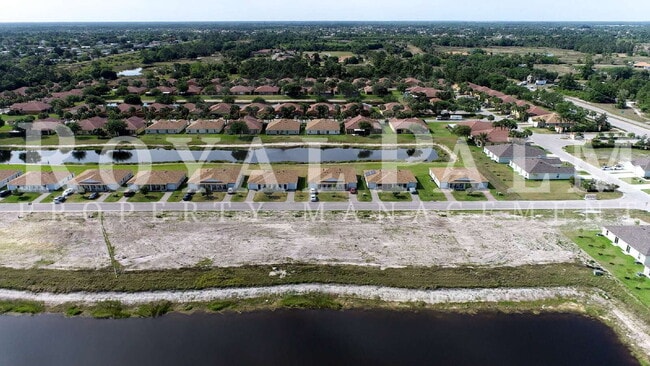 Building Photo - Your Season to Settle In – 3BR/2BA Duplex in Vistanna Villas, Lehigh Acres with Space, Style & St...