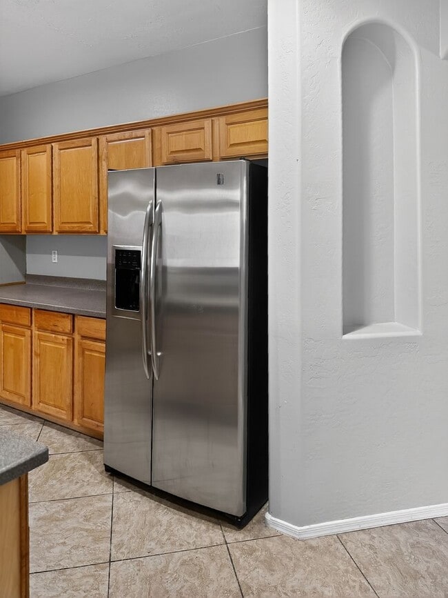 Building Photo - Single-level 4 bed, 2 bath home with tandem 3-car garage and RV gate.