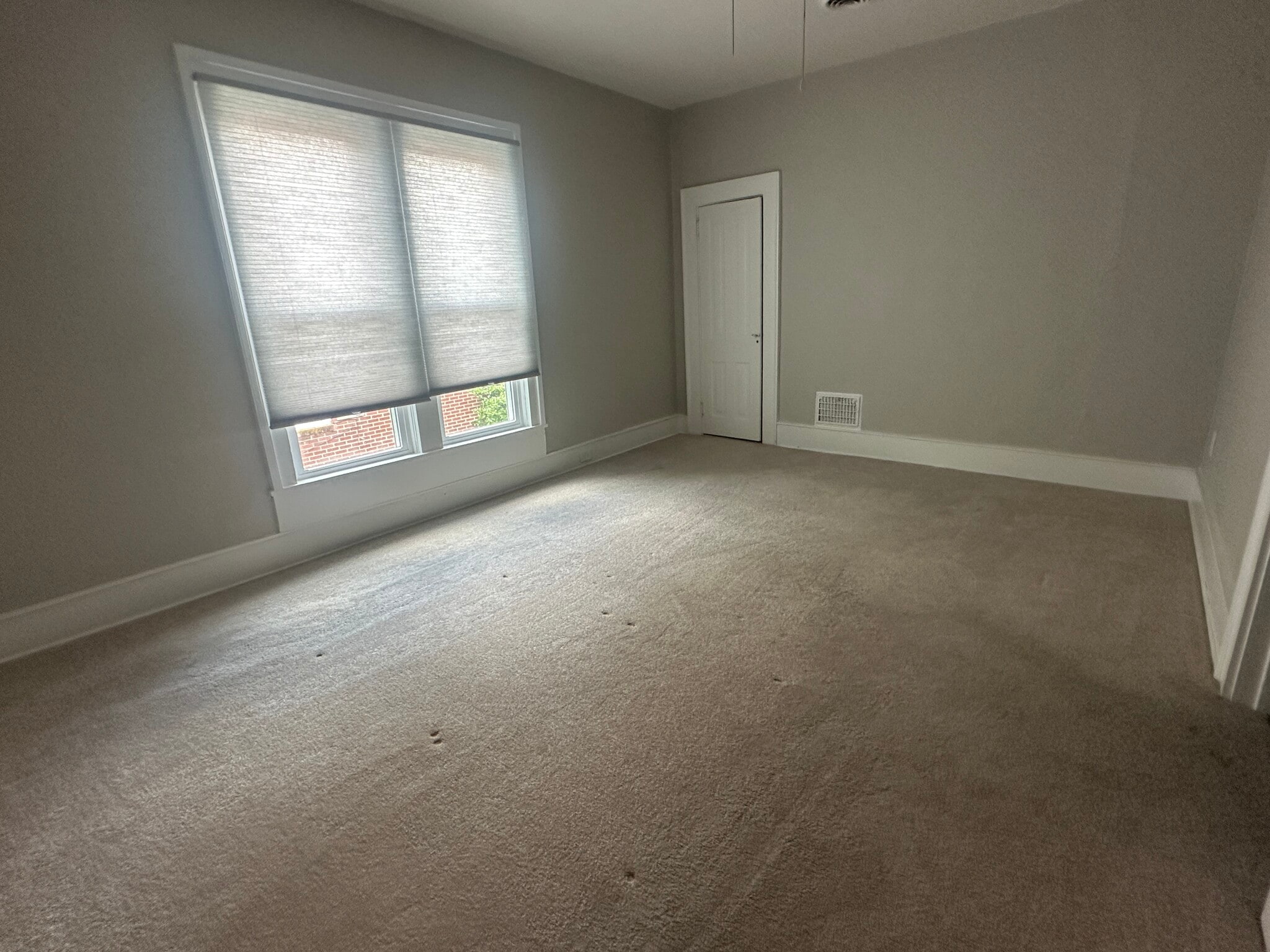 Bedroom with carpet - 306 N Main St