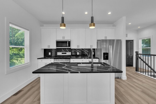 Building Photo - Modern New Construction Townhome with Roof...