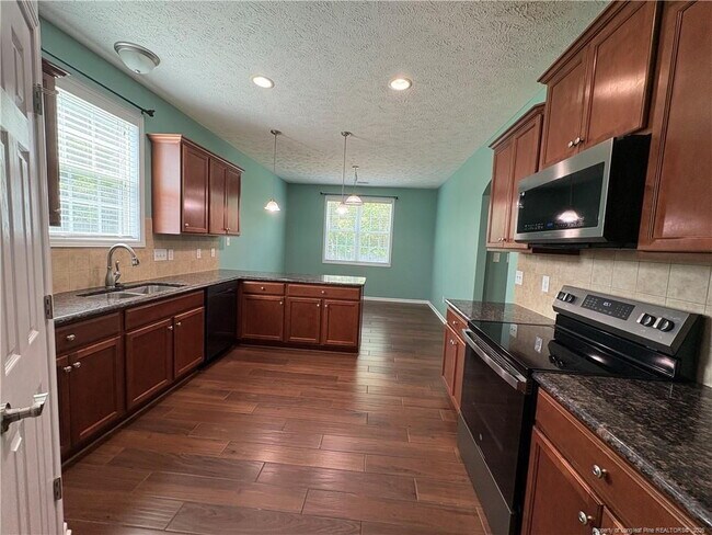 Building Photo - Experience Elegance: 4-Bedroom Gem with Granite Charm on Beaubien Drive