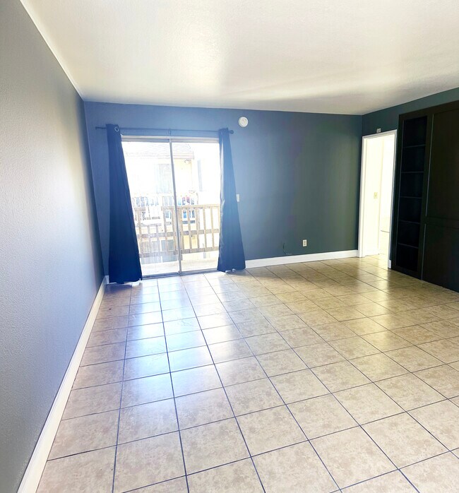 large living room with balcony - 240 E Graham Ave