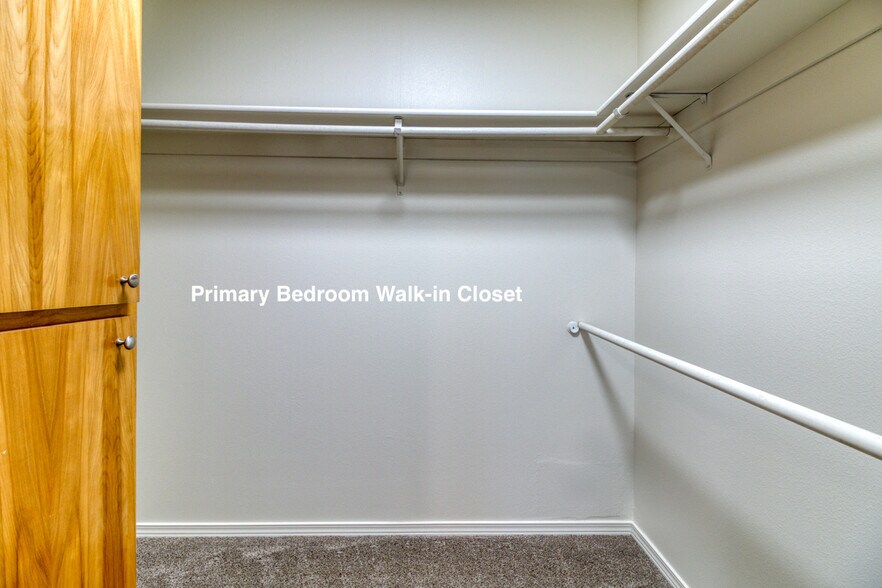 Primary Bedroom Walk-in Closet - 1923 NE Derek Dr