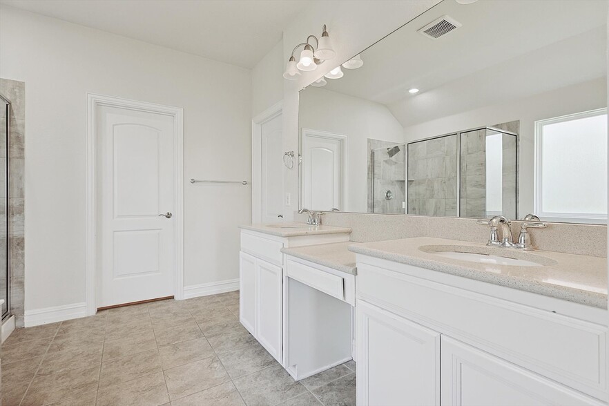 Primary bathroom with double sinks and seated vanity - 1329 Millican Ln