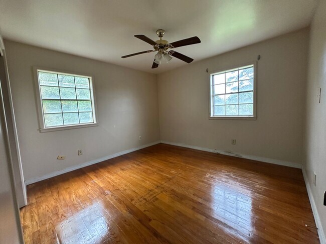 Building Photo - Available July 1st***Welcome to this charming 4-bedroom, 2-bathroom home located in the heart of ...
