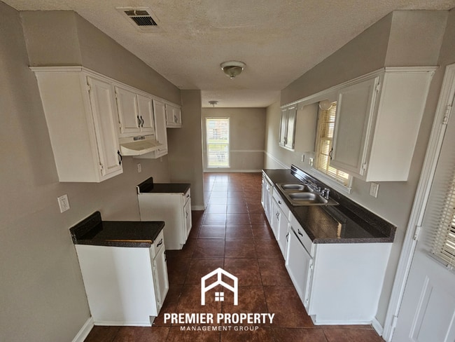 Building Photo - Quiet Cove Living in 38115 | 3BR/2BA with Brick Fireplace & Fenced Yard