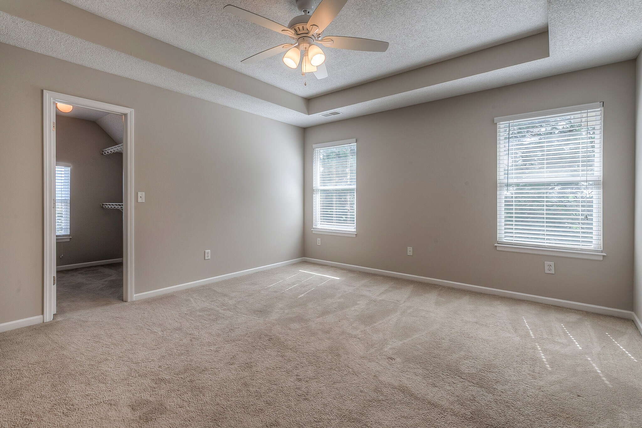 master bedroom with vault and ceiling fan - 22810 West 71st Terrace