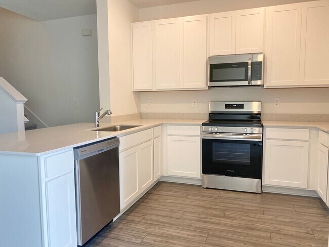 Building Photo - Almost New 3/2/1 Modern Townhome!