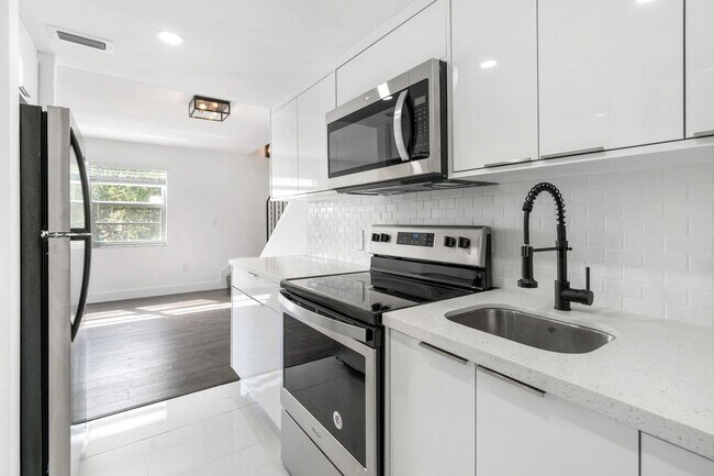 Building Photo - Live in this newly renovated two-story cor...
