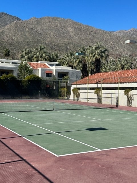 Two separate tennis courts, well lit at night - 255 E Avenida Granada
