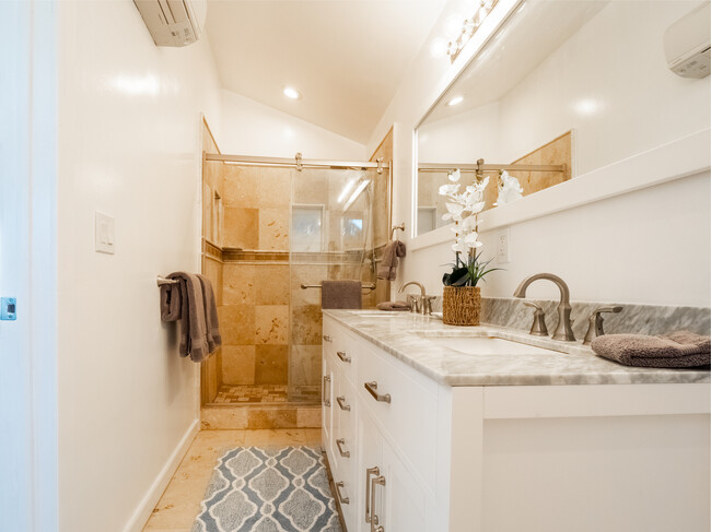 Primary Bedroom #3 walk-in travertine shower - 3250 E De Bazan Ave