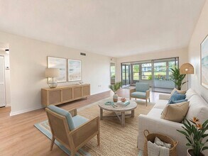 Building Photo - AVAILABLE NOW! Beautifully Renovated First-Floor Condo with Peaceful Screened Lanai