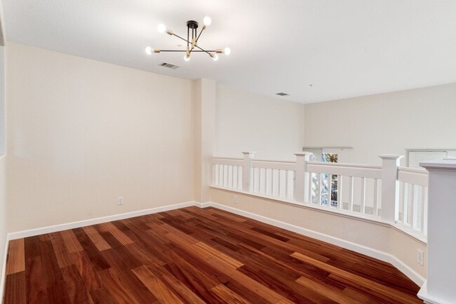 Building Photo - UPGRADED TOWNHOME OFFERS UTMOST CONVENIENCE