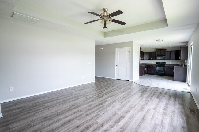 Building Photo - 3 bed home with NEW FLOORING AND FULLY FEN...