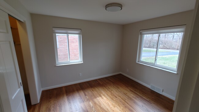 Bedroom 2 with extra large sliding door closet and designer fabric shades - 6934 Winding Way