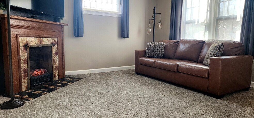 Cozy up near the fireplace after a day exploring Duluth - 822 E 4th St