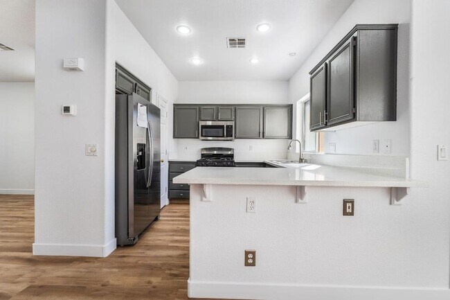Building Photo - Silverado Ranch: Bright, Open Concept 3/2/2 Home with Downstairs Bedroom & Full Bath, Community Pool