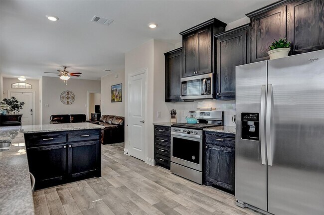 Building Photo - 3 Bed rooms and 2 baths, large master closet. Vinyl garage floor coating is just one of the many ...