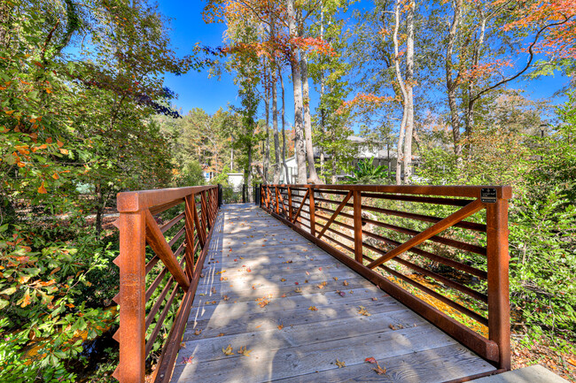 Bridge over Rae's Creek that flows through the community - Forest Hills Racquet Club