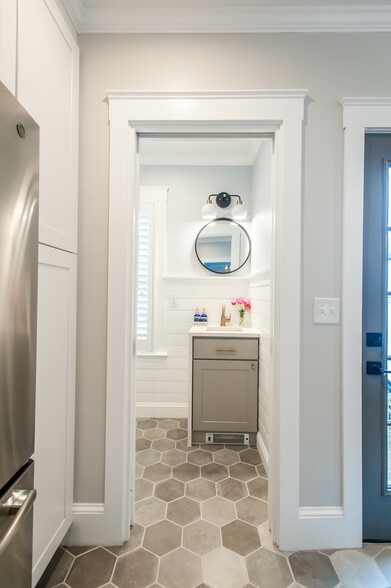 brand new powder room with shiplap, waterfall quartz vanity, and thibaut wallpaper. - 229 Summit Ave