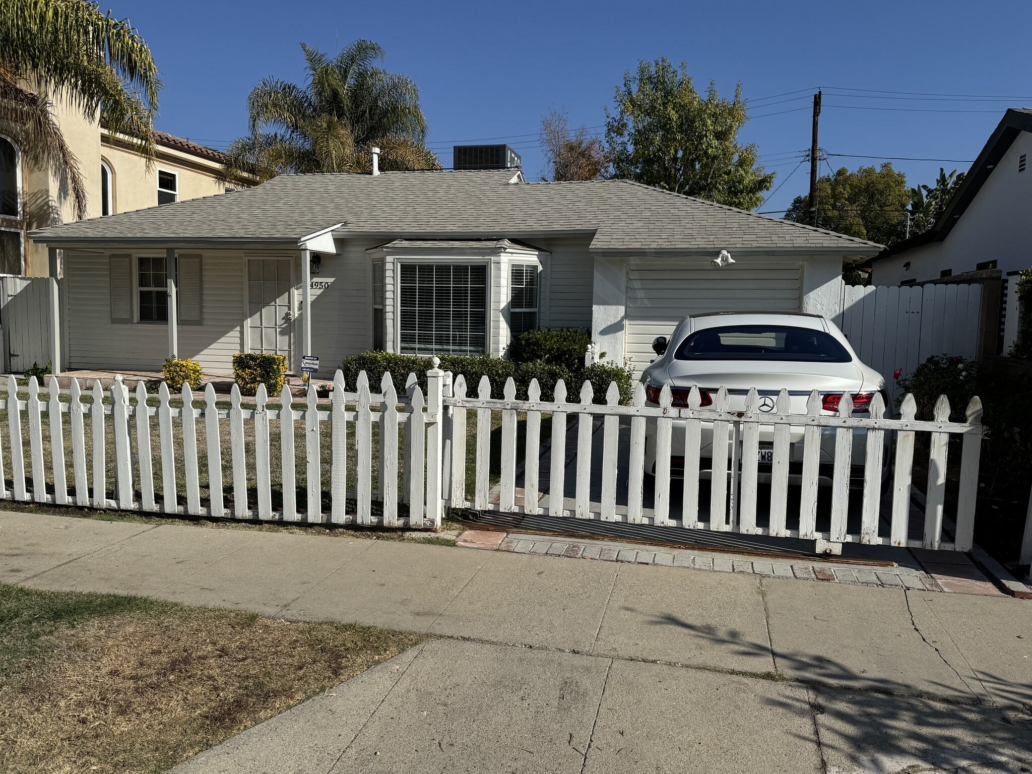 fencing rolls across driveway - 4950 Chimineas Ave