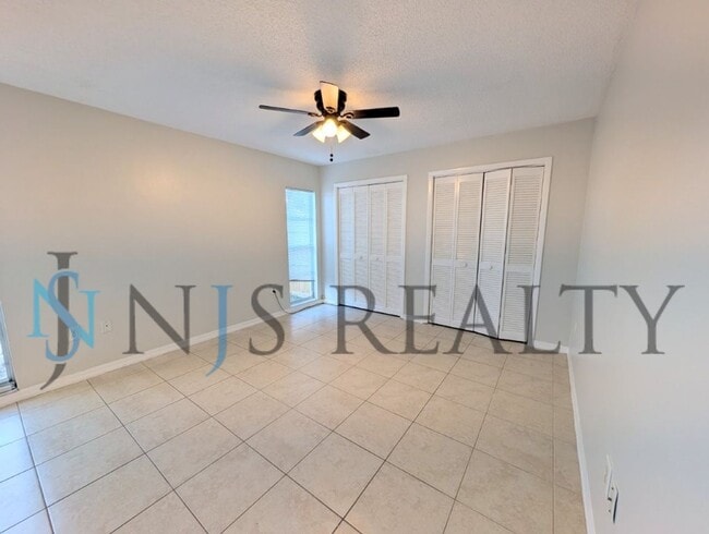 Building Photo - Beautifully updated 3/2/2 1500 Sq. Ft. with fenced yard, tile floors, HUGE living room and a corn...