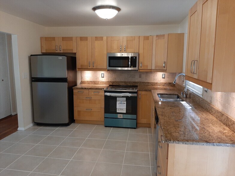 Updated kitchen with stainless steel appliances. - 2955 Fantasy Ln