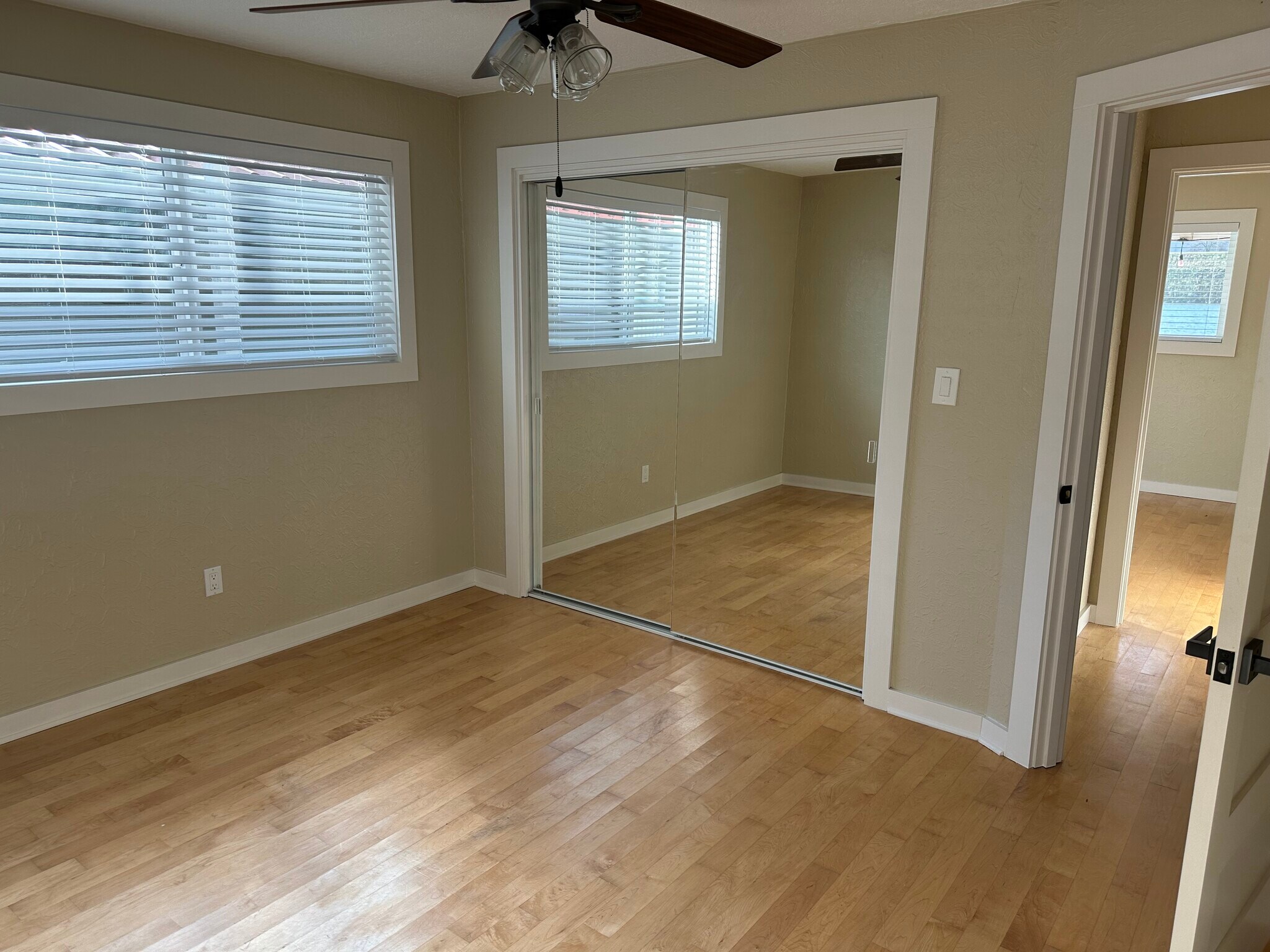The back bedroom has a large closet, and still covers a glimpse of the water. - 1879 N Jantzen Ave