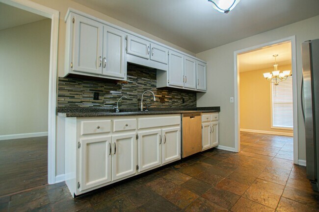 Building Photo - Pet Friendly Three Bedroom with Bonus!