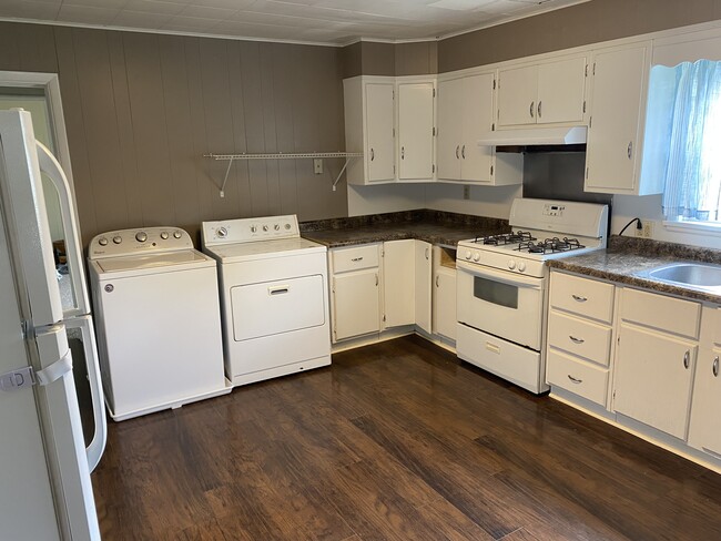 Kitchen w/ provided washer and dryer - 845 Clark St